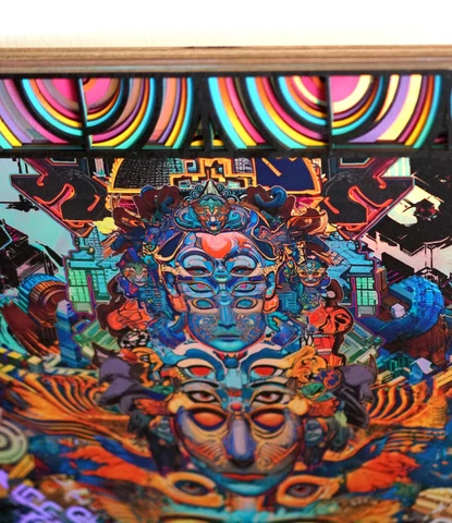 Detail photograph of Android Jones’s Meta Mask print in a layered lasercut frame by Dead Fish Studios